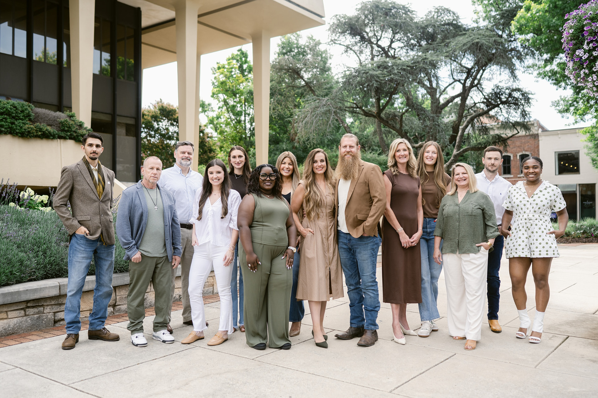 The Cinder Group team gathered together outdoors